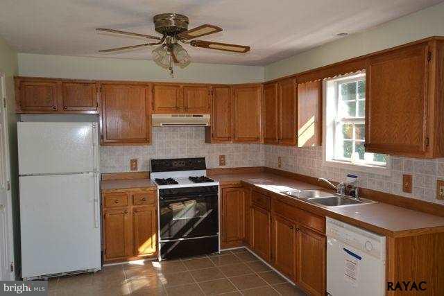 104 Ruel Avenue Hanover, PA 17331 - Photo 4 of 11 a kitchen with a sink appliances and cabinets