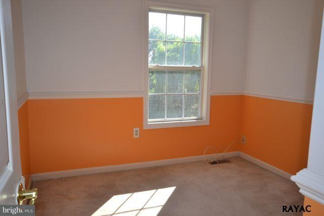 104 Ruel Avenue Hanover, PA 17331 - Photo 6 of 11 an empty room with a window