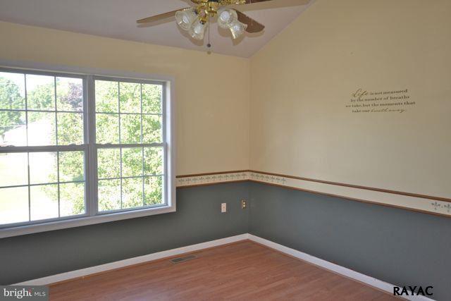 104 Ruel Avenue Hanover, PA 17331 - Photo 8 of 11 wooden floor in an empty room with a window
