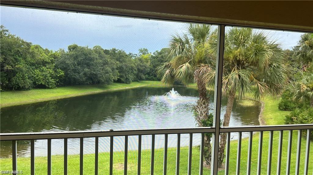 321 Robin Hood Circle, Unit 201 Naples, FL 34104 - Photo 17 of 28 a view of a lake from a balcony
