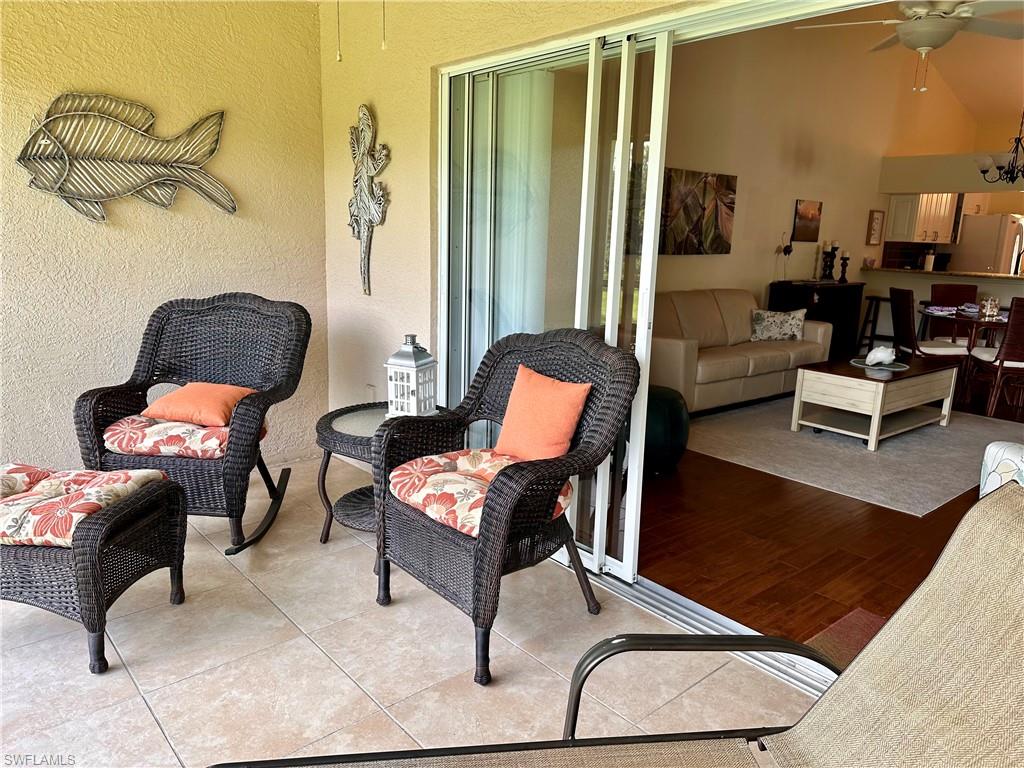 321 Robin Hood Circle, Unit 201 Naples, FL 34104 - Photo 20 of 28 a living room with furniture
