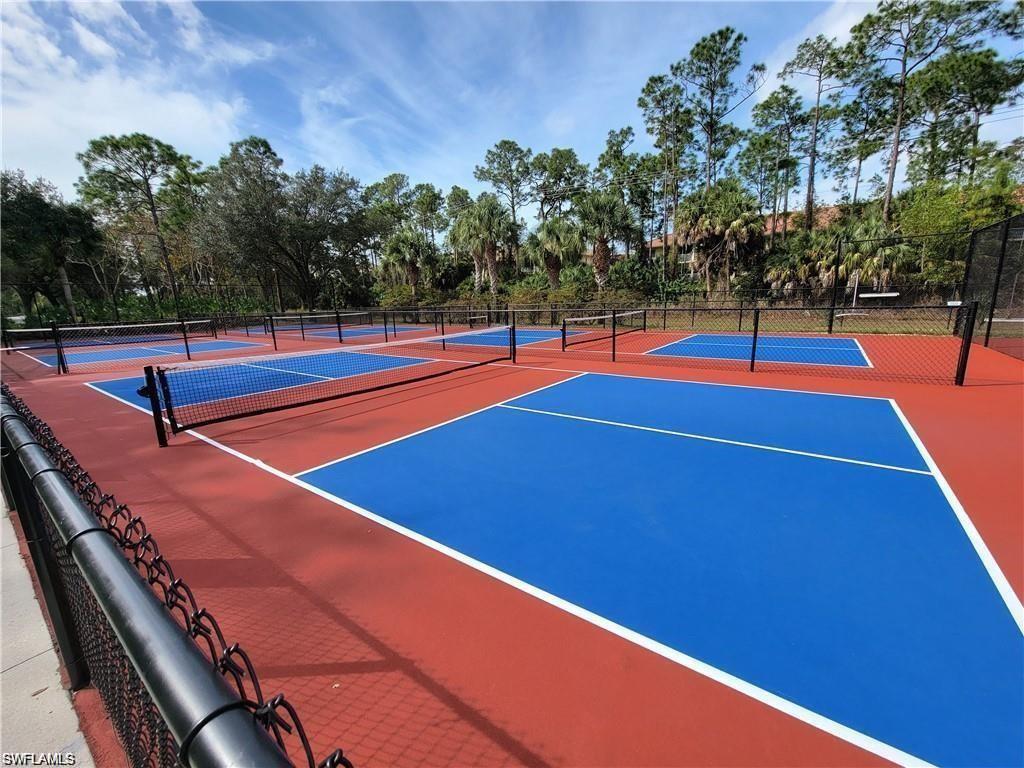 321 Robin Hood Circle, Unit 201 Naples, FL 34104 - Photo 28 of 28 a view of outdoor space and basketball court