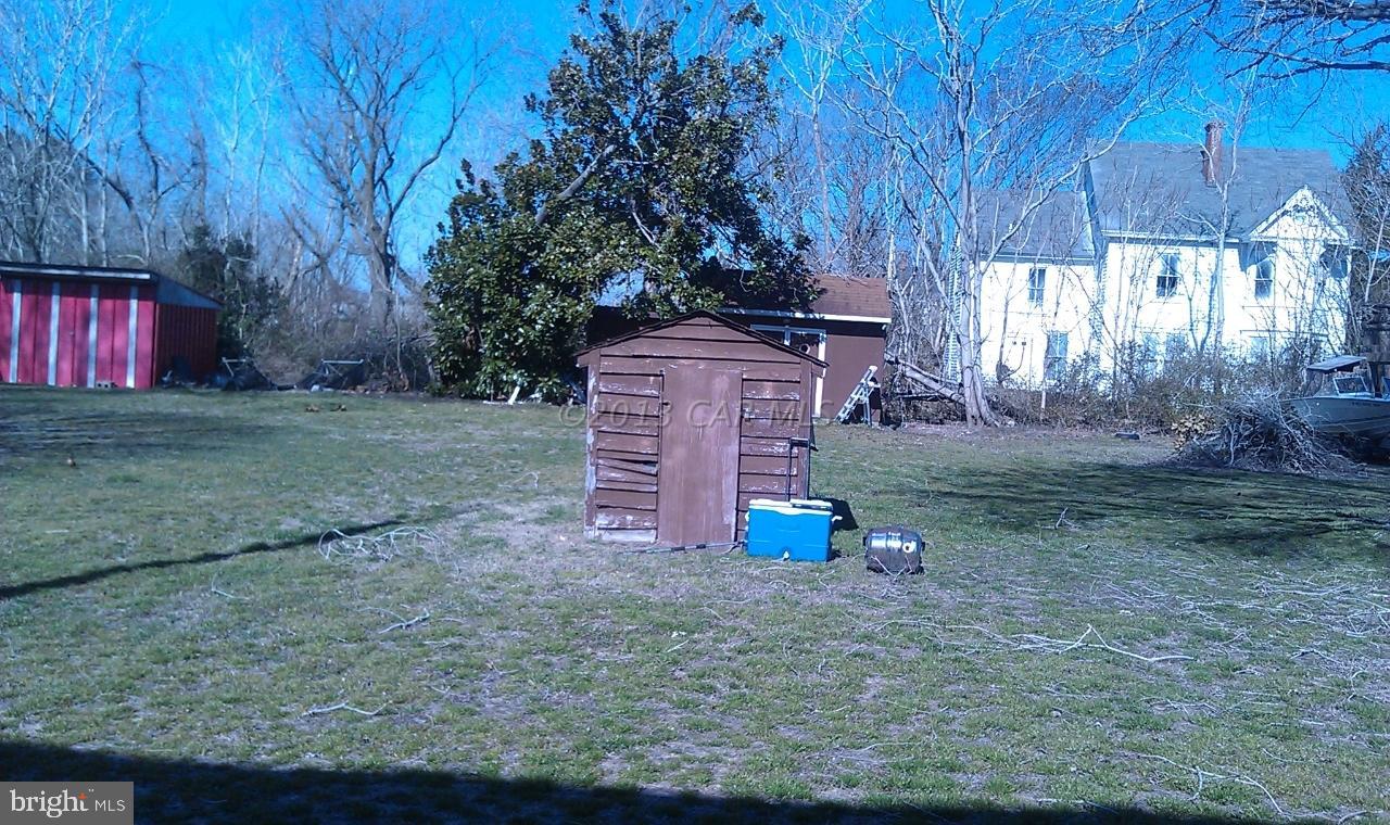 1439 Snow Hill Road Stockton, MD 21864 - Photo 4 of 8 a view of a backyard with barn