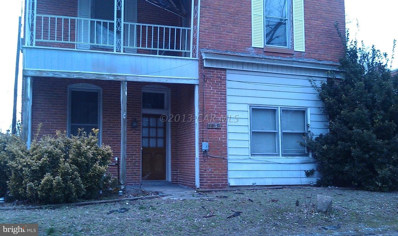 1439 Snow Hill Road Stockton, MD 21864 - Photo 5 of 8 a view of a house with a yard plants and large tree