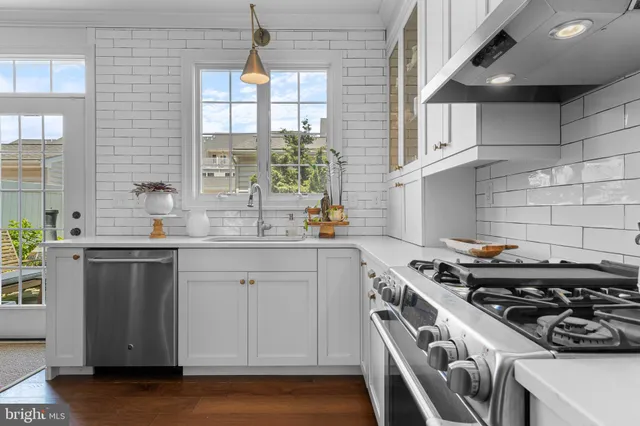 a kitchen with a stove and a sink