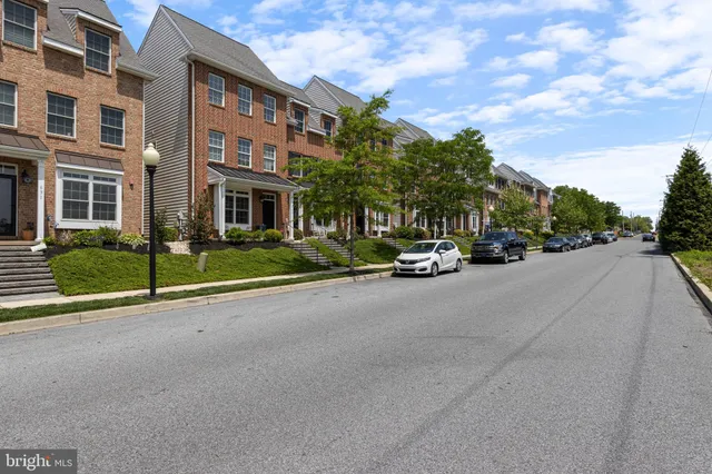 a view of street with parked cars