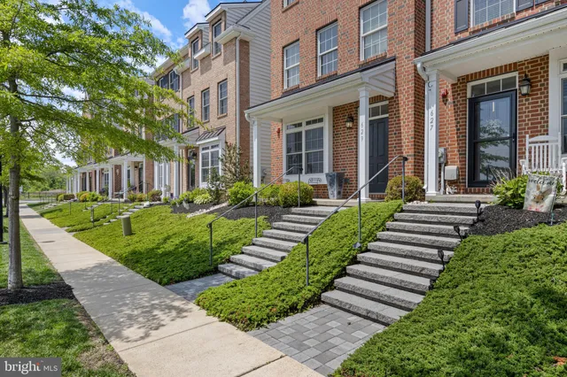 a view of a house with a yard and plants