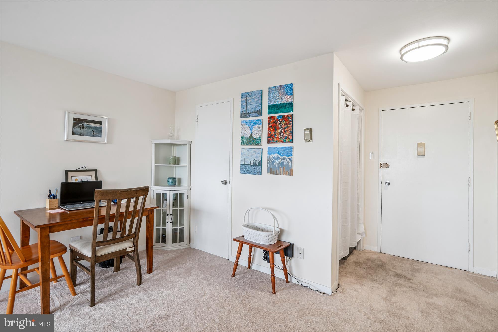 1900 Lyttonsville Road, Unit 1308 Silver Spring, MD 20910 - Photo 6 of 52 a view of a workspace with furniture and a window