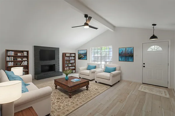 a living room with furniture and a flat screen tv