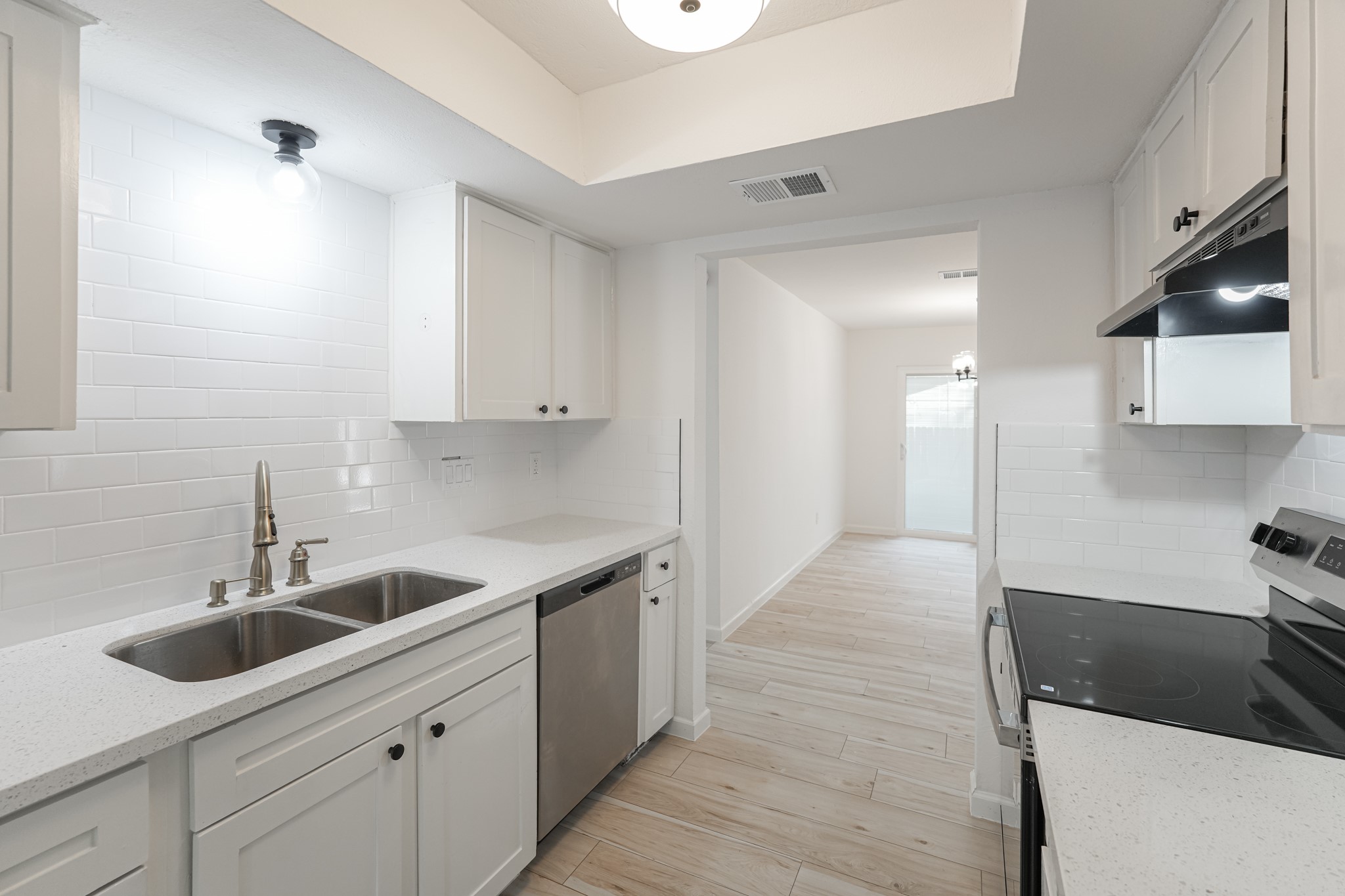 5311 Oaklynn Drive Spring, TX 77373 - Photo 17 of 33 a kitchen with a sink and cabinets