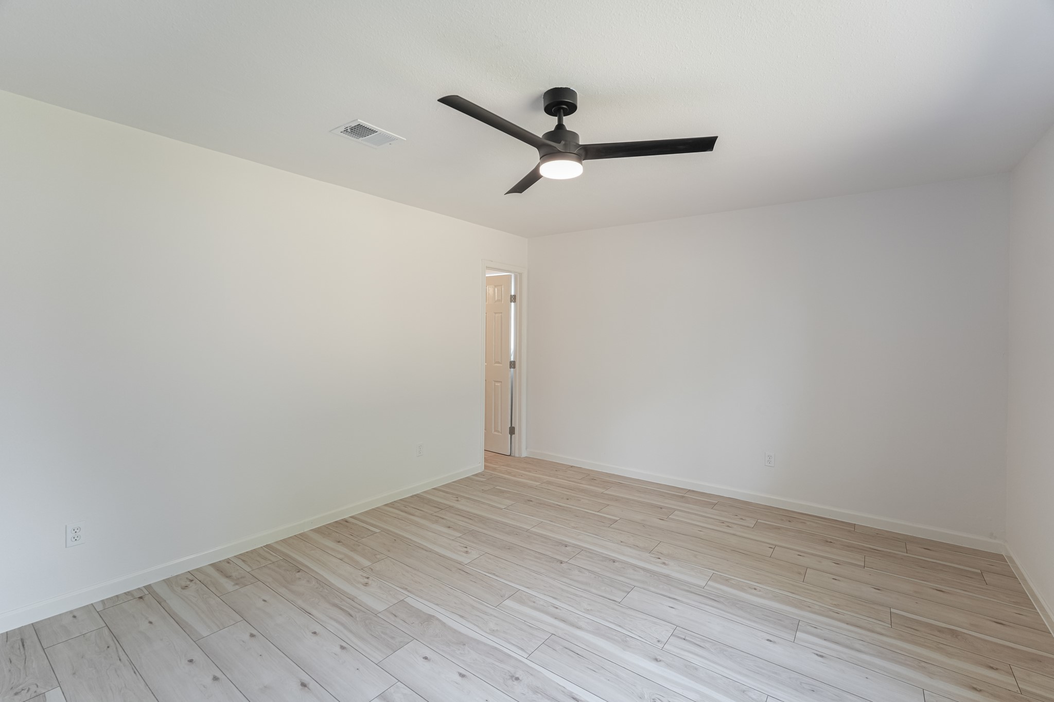 5311 Oaklynn Drive Spring, TX 77373 - Photo 20 of 33 a view of a room with wooden floor