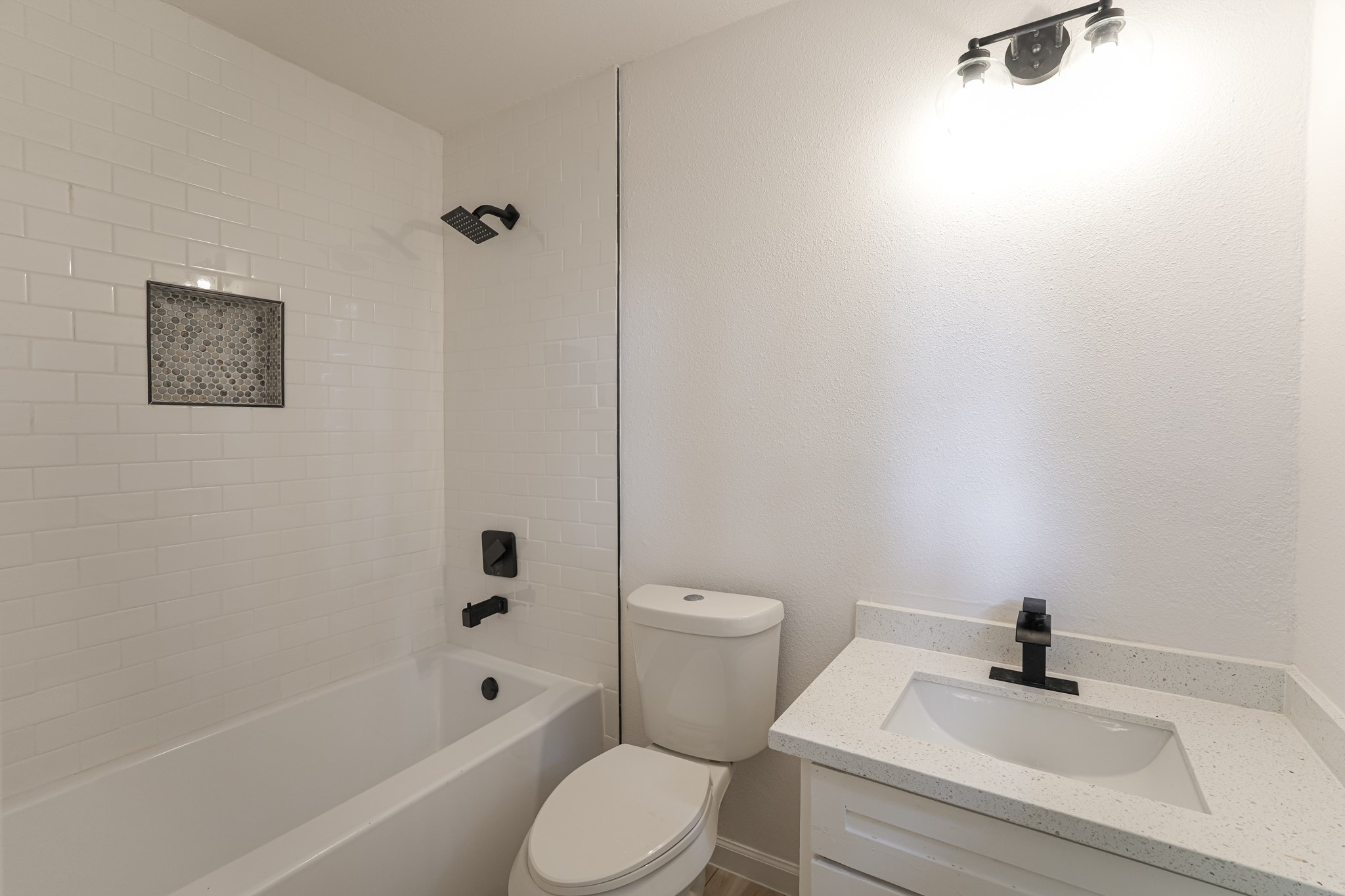 5311 Oaklynn Drive Spring, TX 77373 - Photo 21 of 33 a bathroom with a sink a toilet and shower