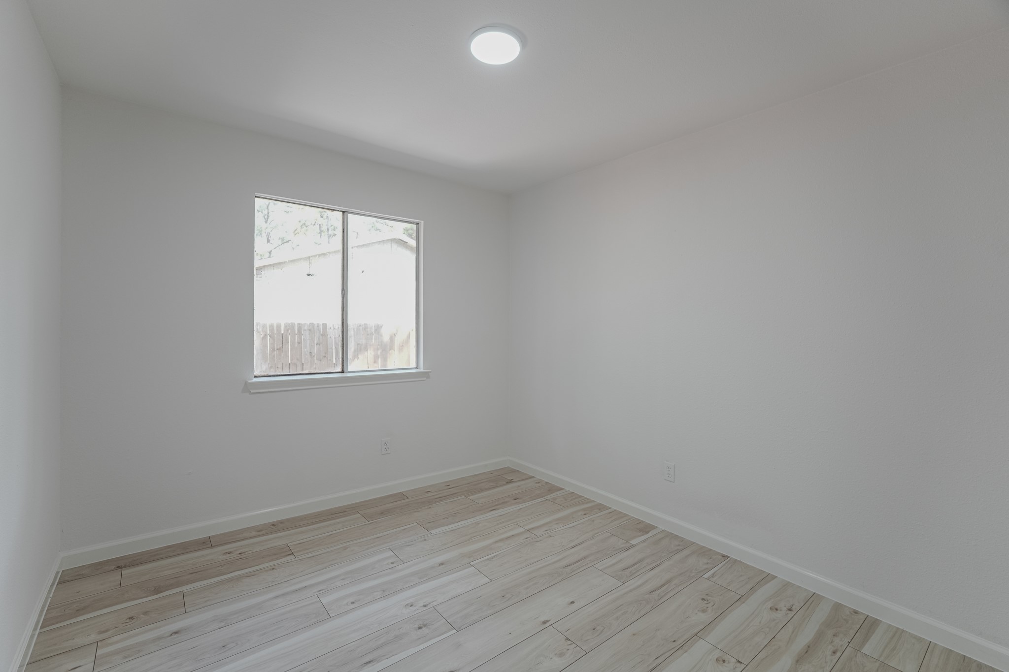 5311 Oaklynn Drive Spring, TX 77373 - Photo 22 of 33 an empty room with a window