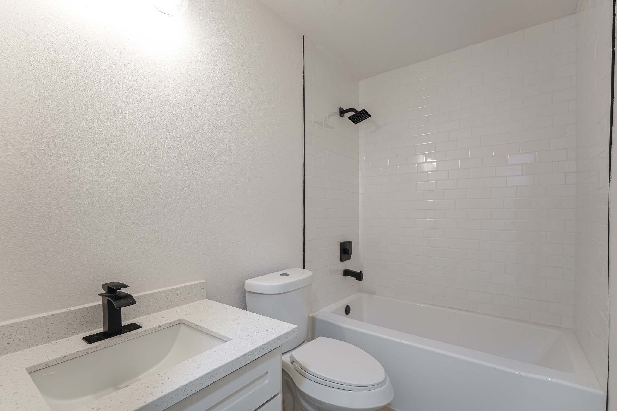 5311 Oaklynn Drive Spring, TX 77373 - Photo 24 of 33 a bathroom with a toilet a sink and bathtub