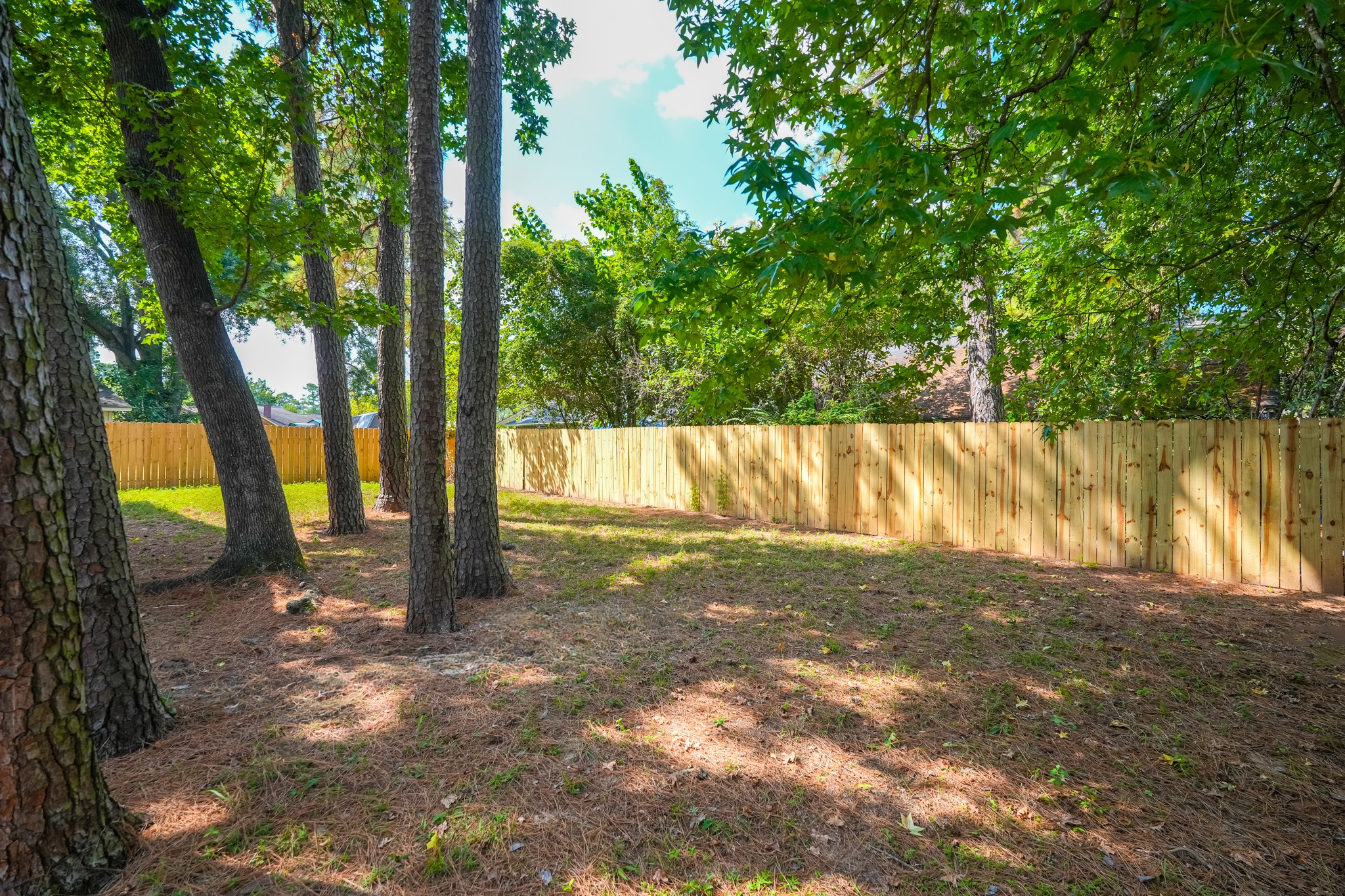 5311 Oaklynn Drive Spring, TX 77373 - Photo 29 of 33 a view of a yard with wooden fence