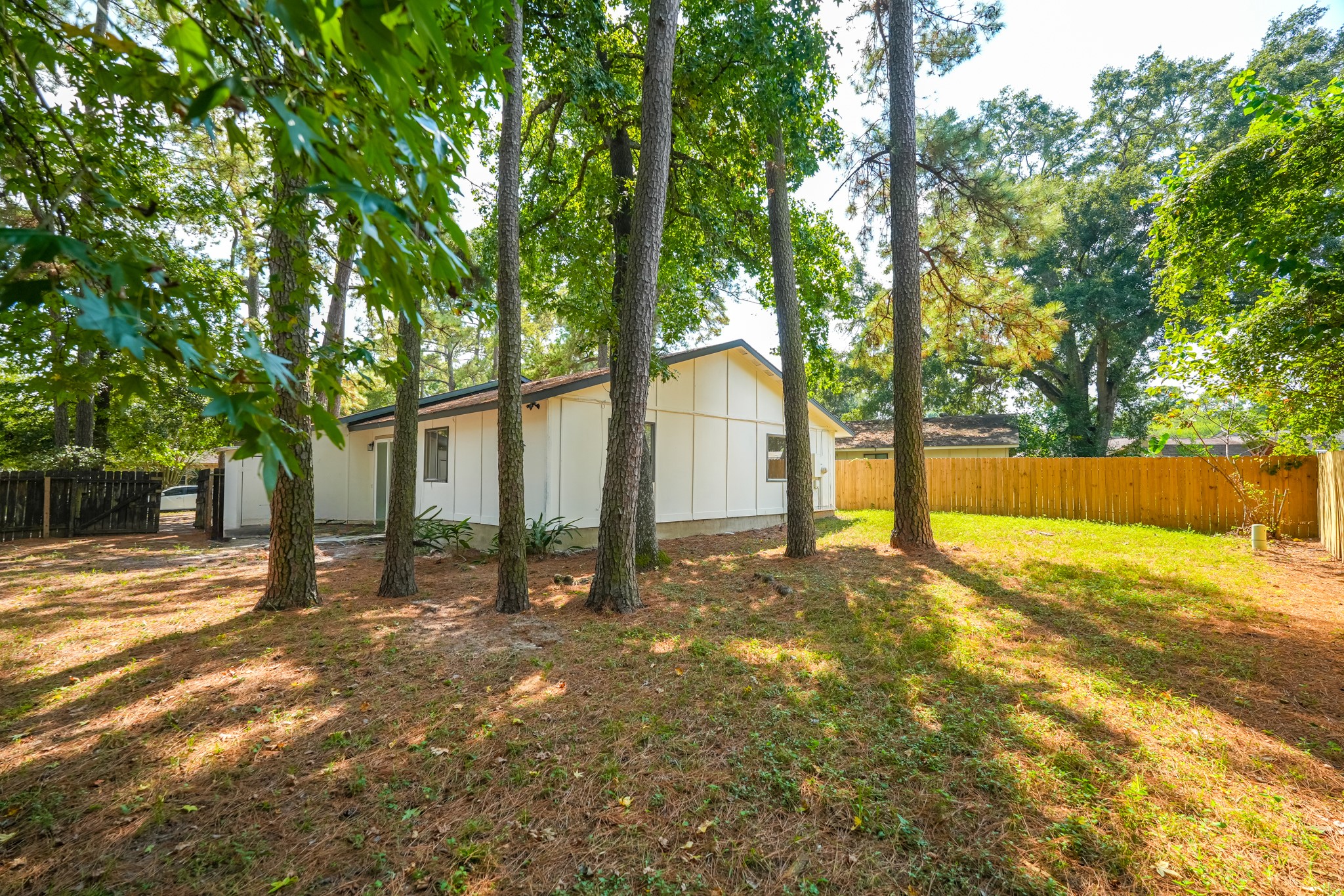 5311 Oaklynn Drive Spring, TX 77373 - Photo 30 of 33 a view of a yard with tree s