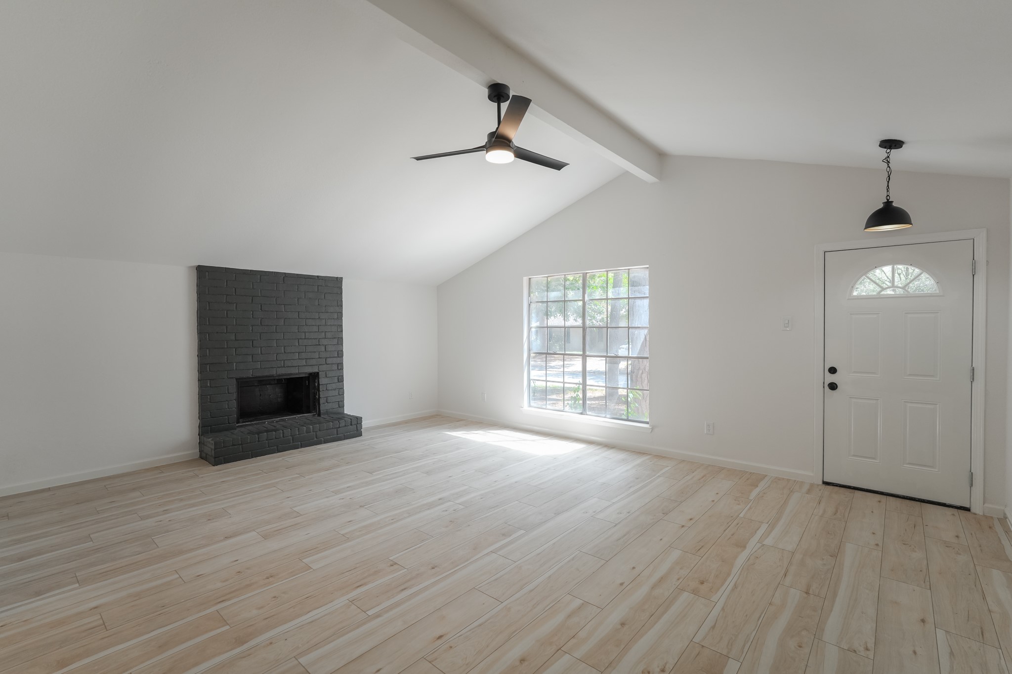 5311 Oaklynn Drive Spring, TX 77373 - Photo 3 of 33 wooden floor in an empty room with a window