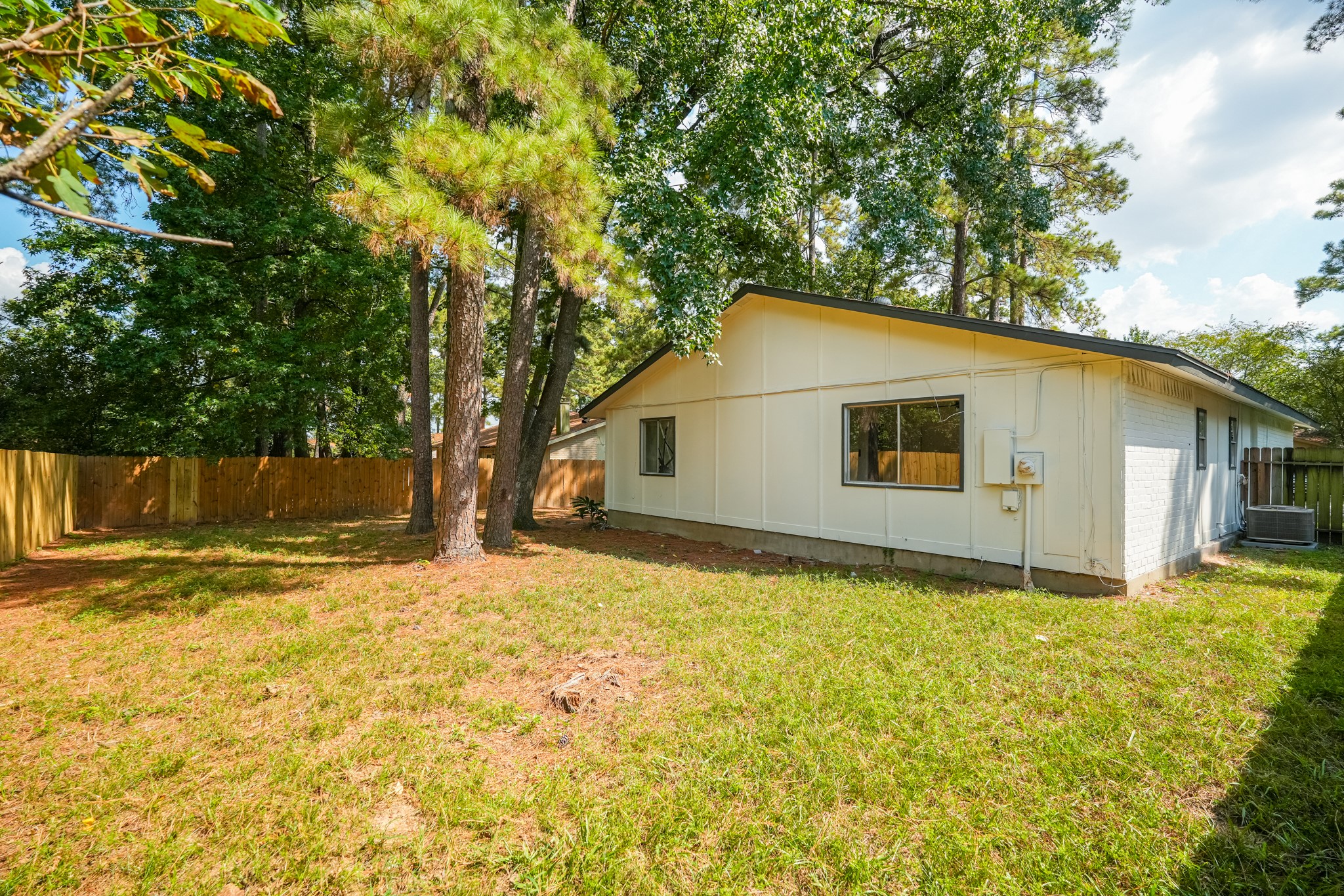 5311 Oaklynn Drive Spring, TX 77373 - Photo 31 of 33 a backyard of a house with large trees