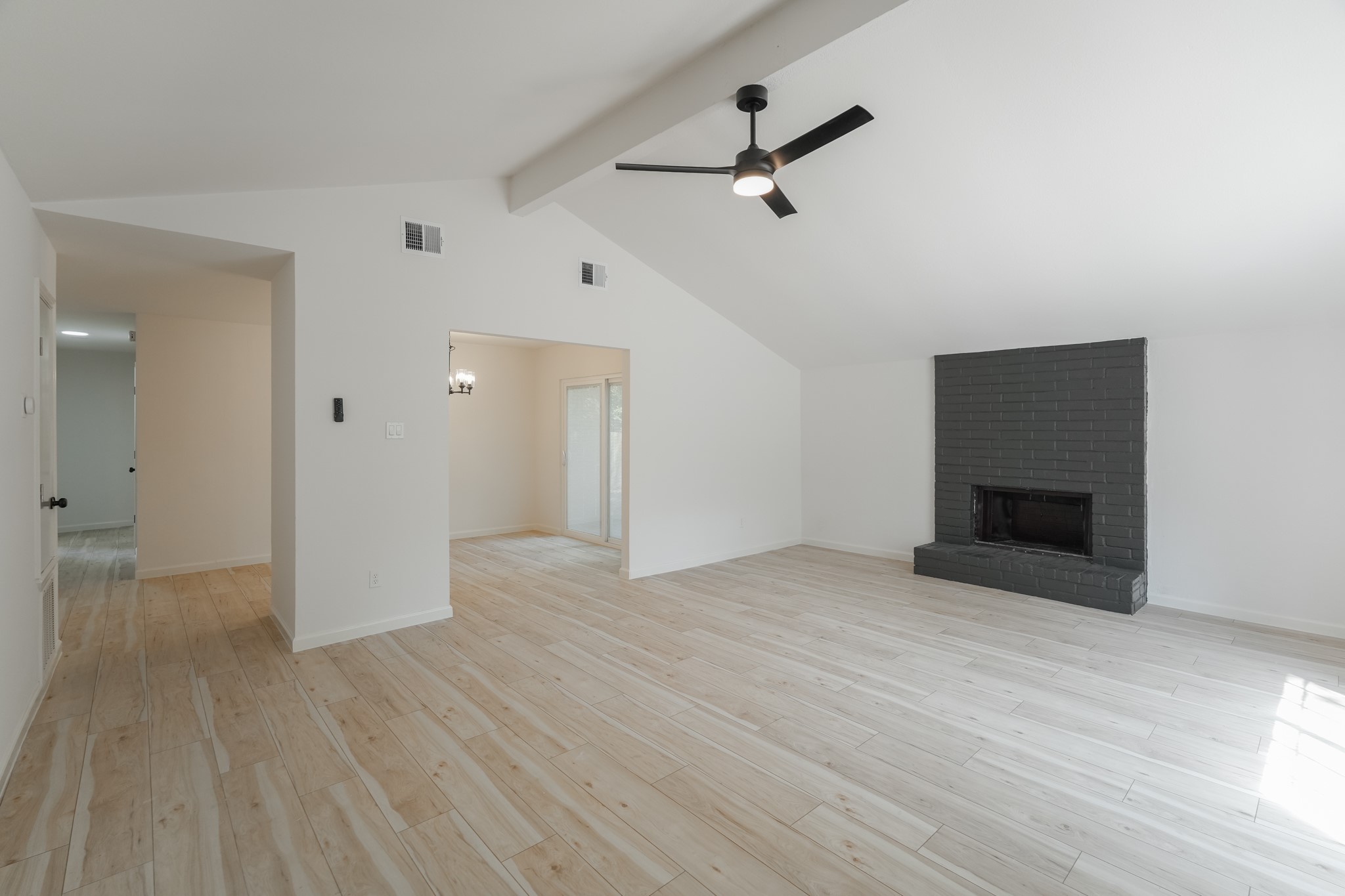 5311 Oaklynn Drive Spring, TX 77373 - Photo 7 of 33 a view of empty room with wooden floor and fireplace