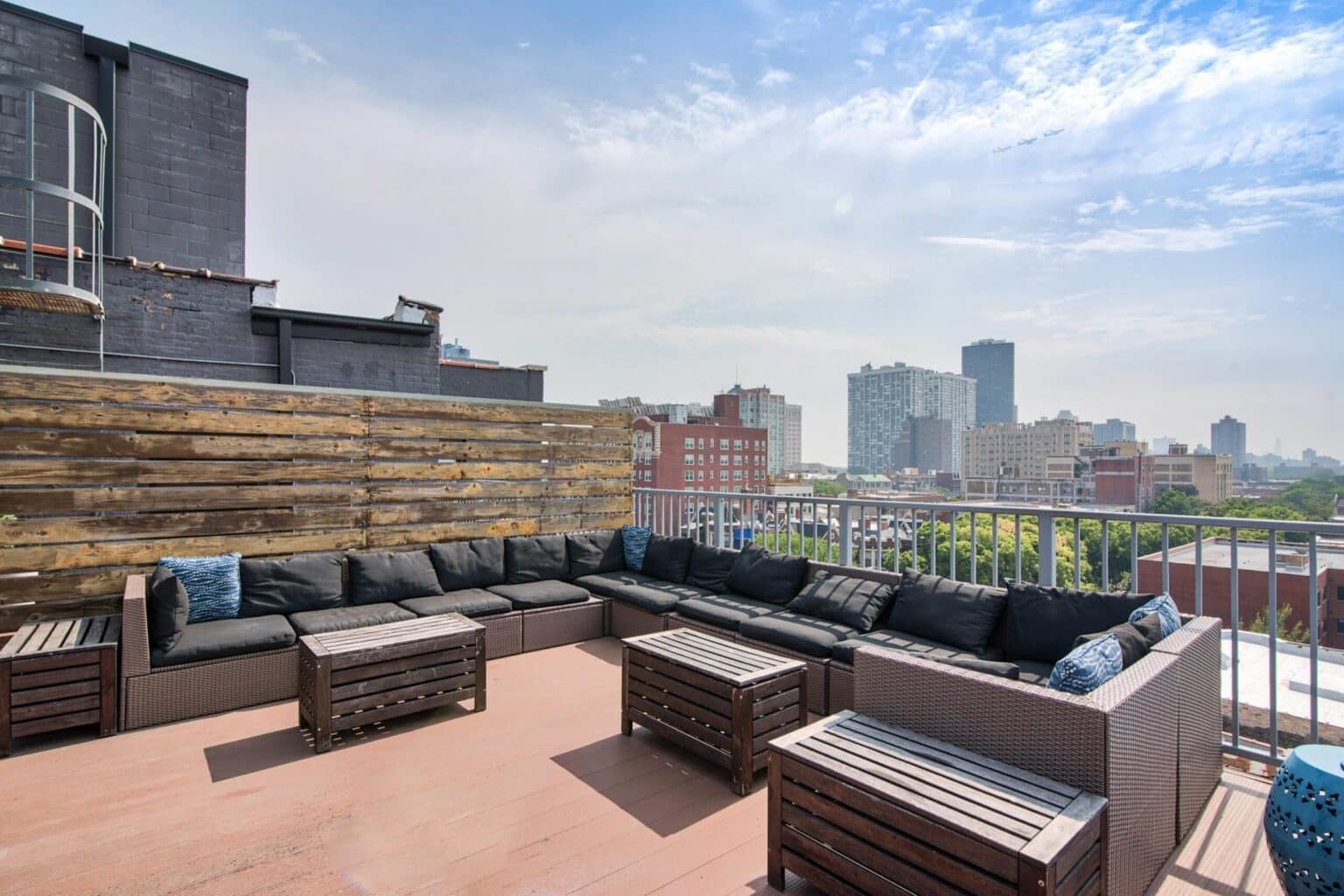 5718 North Winthrop Avenue, Unit 802 Chicago, IL 60660 - Photo 2 of 16 a roof deck with couches and potted plants
