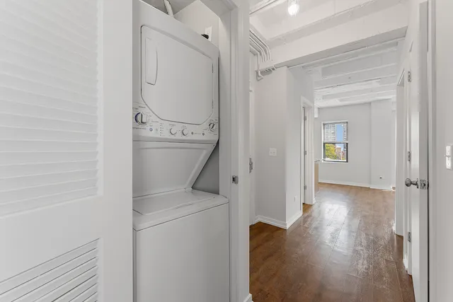 a view of a storage & utility room with a washer dryer