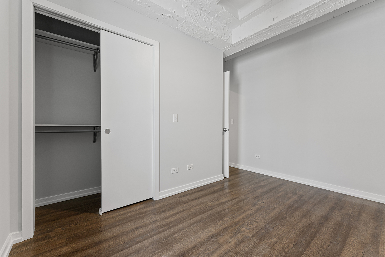 5718 North Winthrop Avenue, Unit 802 Chicago, IL 60660 - Photo 8 of 16 a view of an empty room with wooden floor