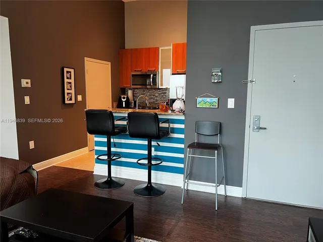 a view of a workspace with furniture