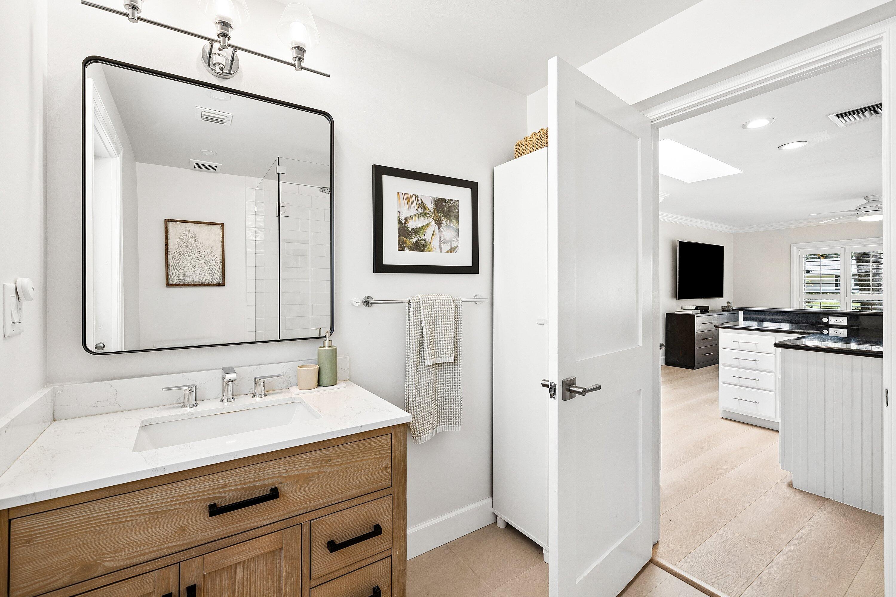 774 Southwest 7th Street Boca Raton, FL 33486 - Photo 14 of 28 a spacious bathroom with a double vanity sink mirror and toilet