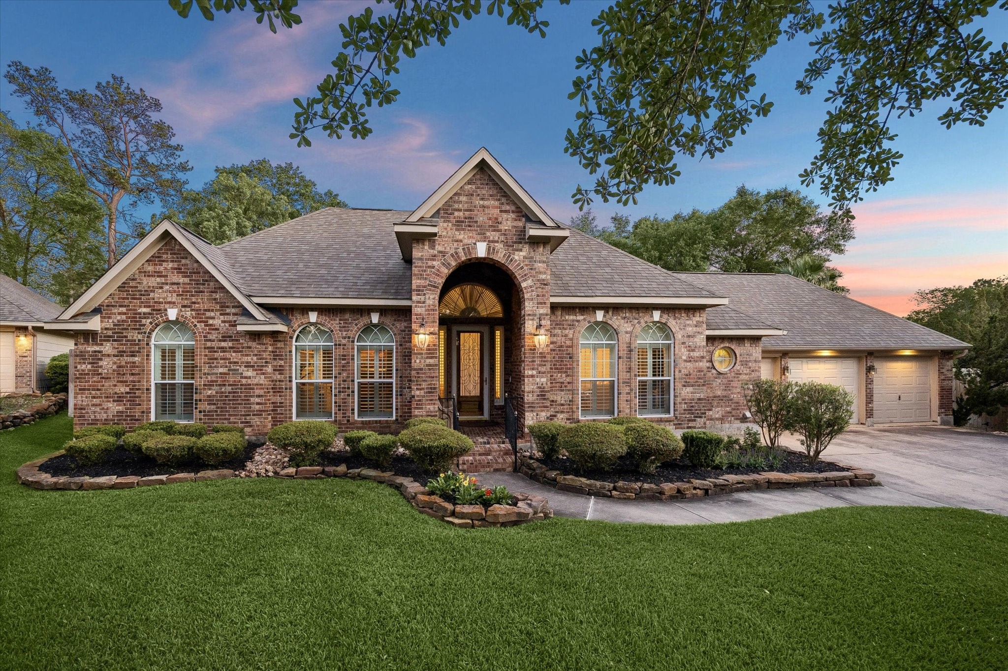 6507 Haughton Court Spring, TX 77389 - Photo 1 of 24 a front view of a house with a yard and porch
