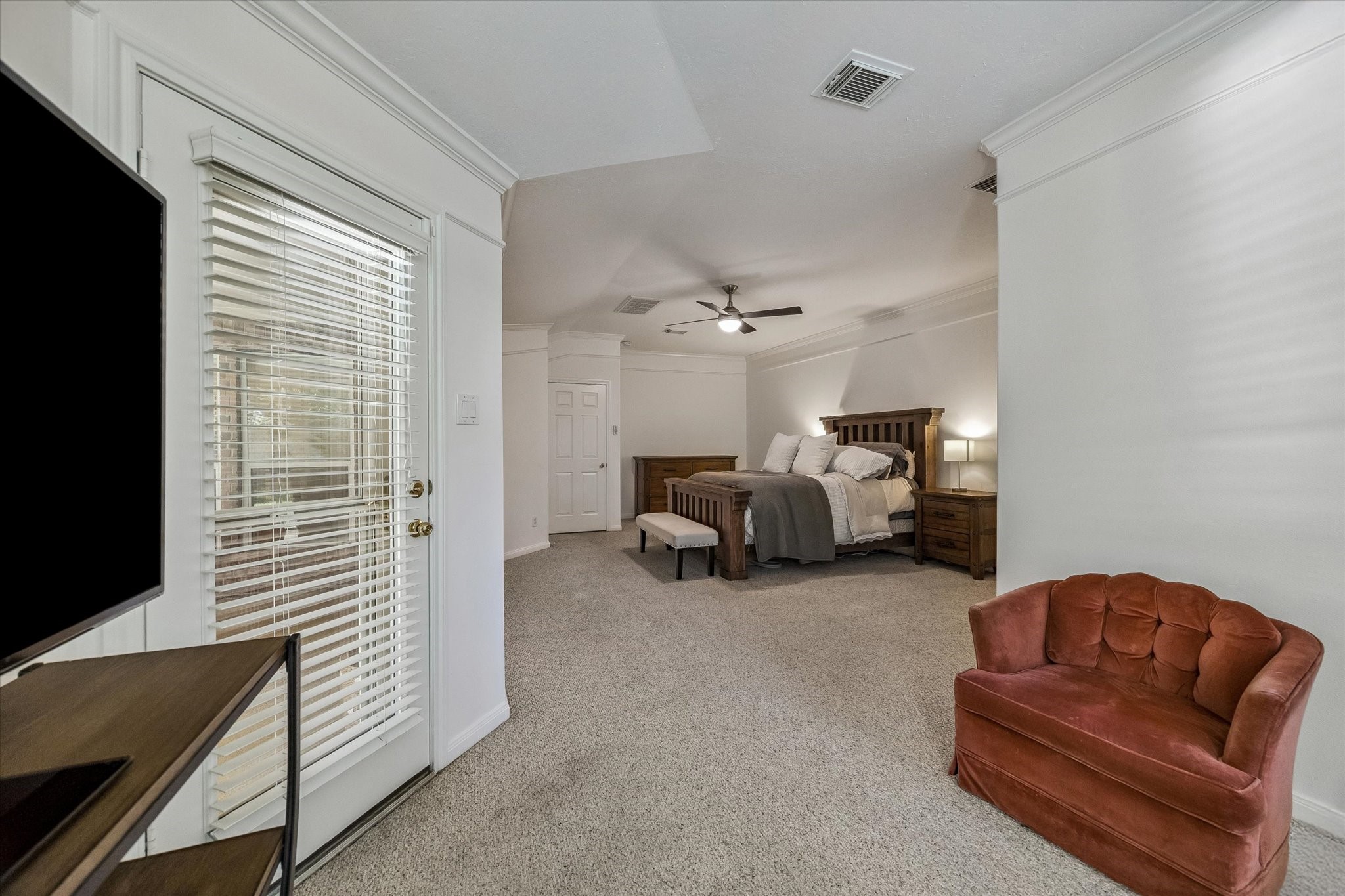 6507 Haughton Court Spring, TX 77389 - Photo 14 of 24 a bed room with furniture and a flat screen tv