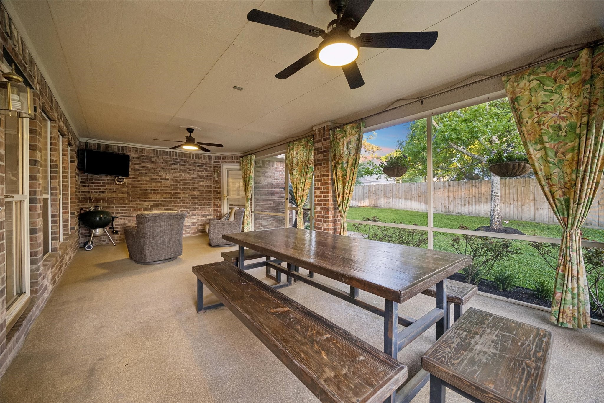 6507 Haughton Court Spring, TX 77389 - Photo 18 of 24 a living room with patio furniture and a floor to ceiling window