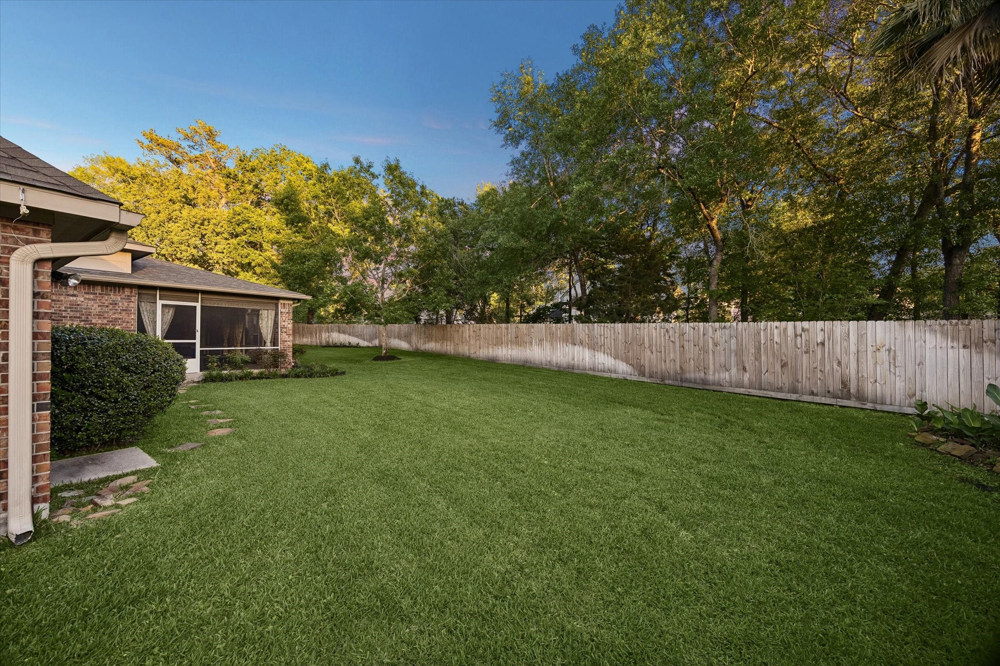 6507 Haughton Court Spring, TX 77389 - Photo 20 of 24 a view of a house with backyard and a tree
