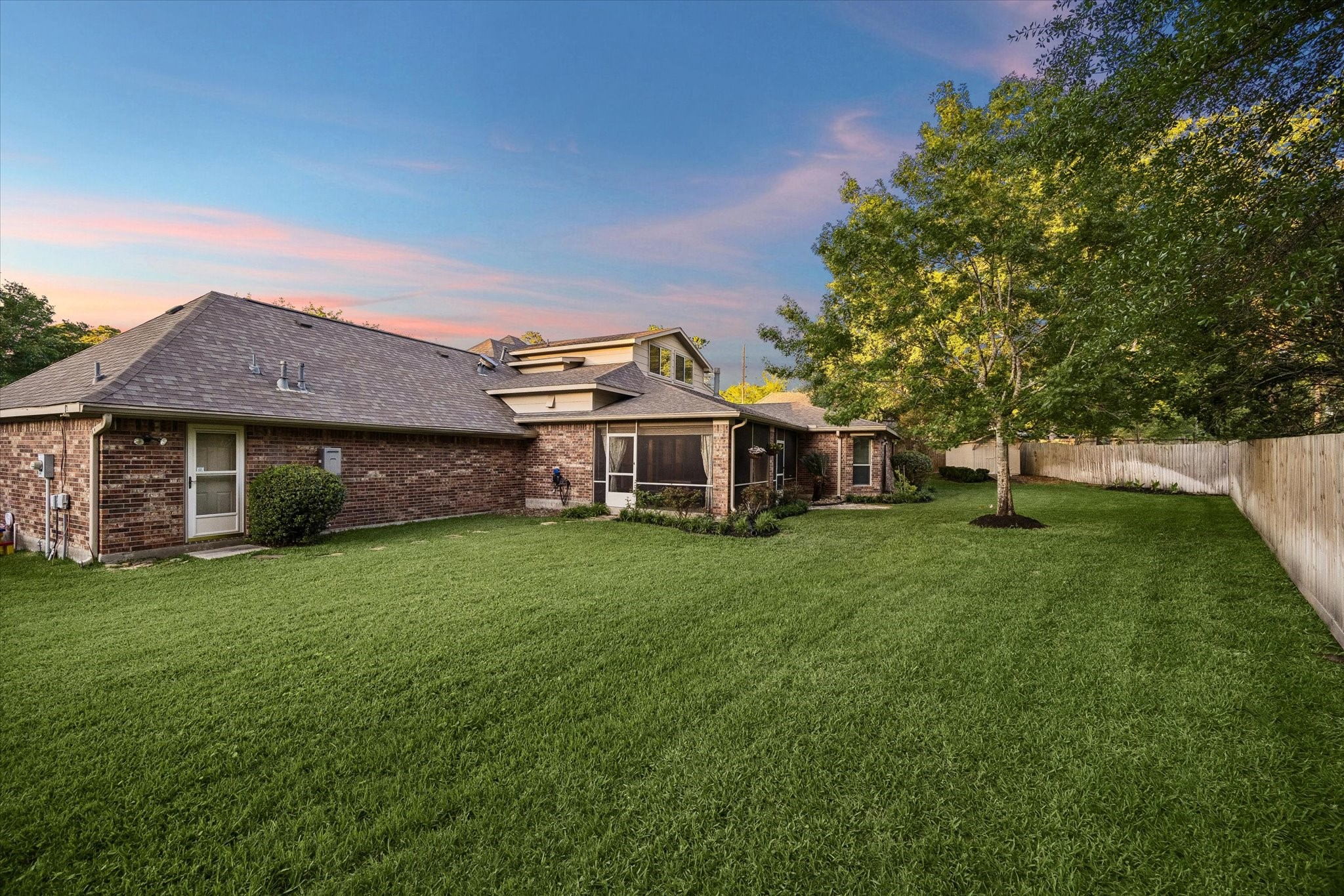 6507 Haughton Court Spring, TX 77389 - Photo 21 of 24 a front view of a house with a garden