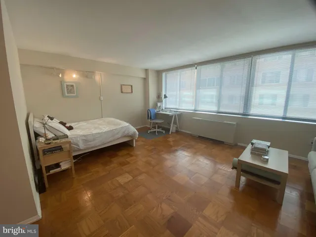 a bed room with a bed and furniture
