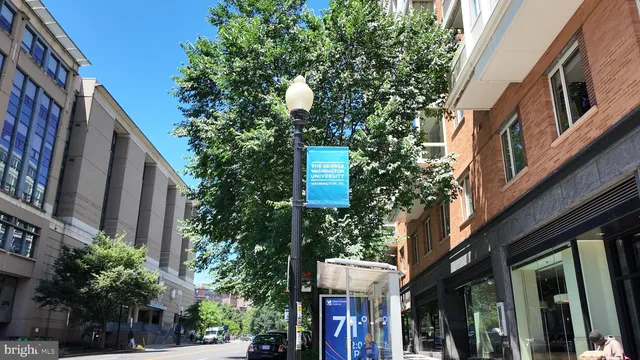 a front view of a building with a garden