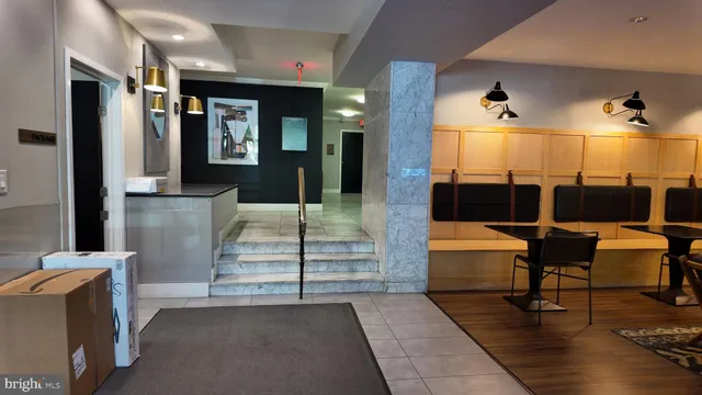 a lobby with furniture and wooden floor
