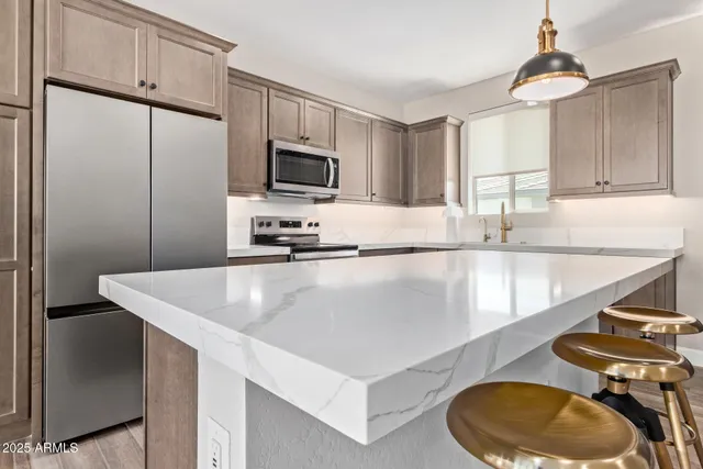 a stove top oven sitting inside of a kitchen