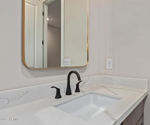 a wall with a close up of a sign