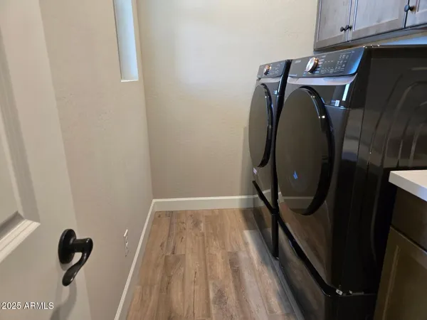 a kitchen with kitchen island a counter space a sink and appliances