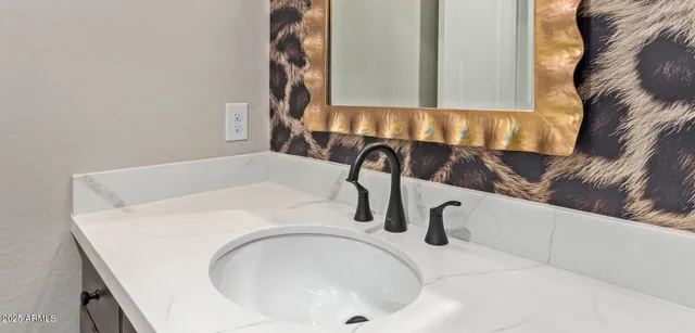 a view of staircase with railing and white walls