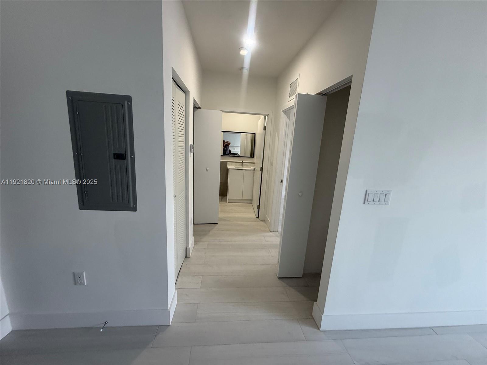 909 East 24th Street, Unit 403 Hialeah, FL 33013 - Photo 15 of 20 a view of a hallway with a hallway