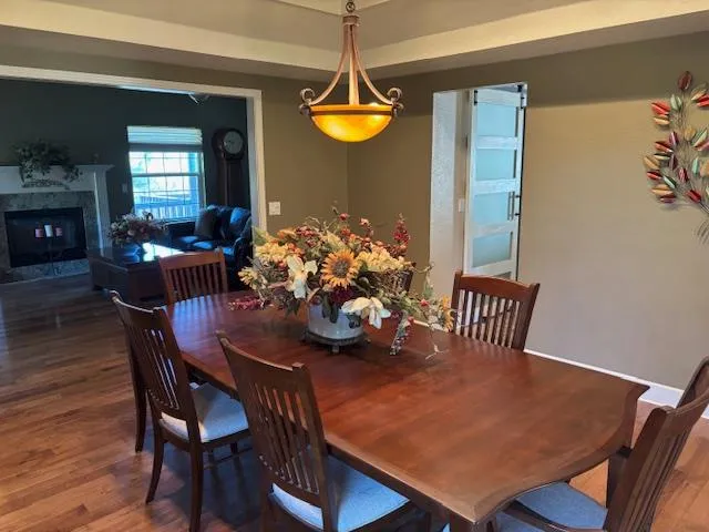 a dining room with furniture and window