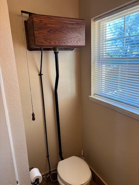 2579 Otter Trail Cool, CA 95614 - Photo 18 of 53 a bathroom with a toilet and a window