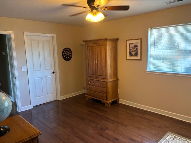 2579 Otter Trail Cool, CA 95614 - Photo 27 of 53 an empty room with wooden floor a ceiling fan and windows