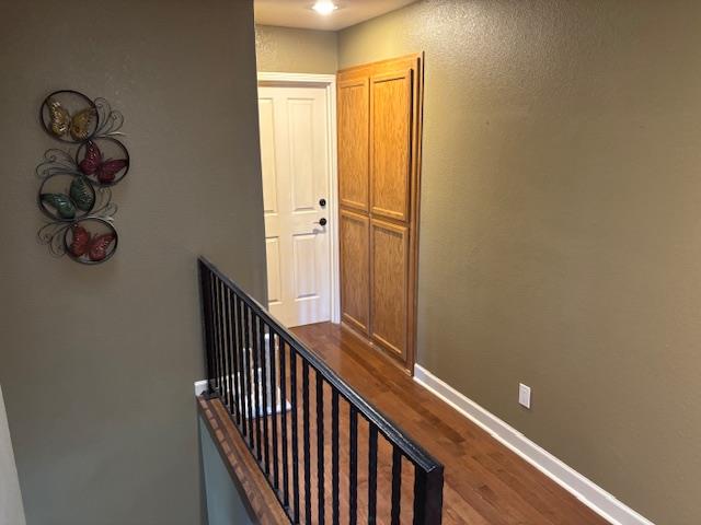 2579 Otter Trail Cool, CA 95614 - Photo 32 of 53 a view of a hallway with wooden floor and stairs