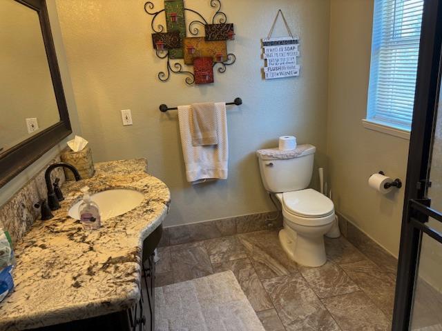 2579 Otter Trail Cool, CA 95614 - Photo 33 of 53 a bathroom with a toilet sink and mirror