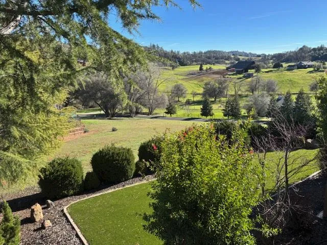 a view of a lake with a yard