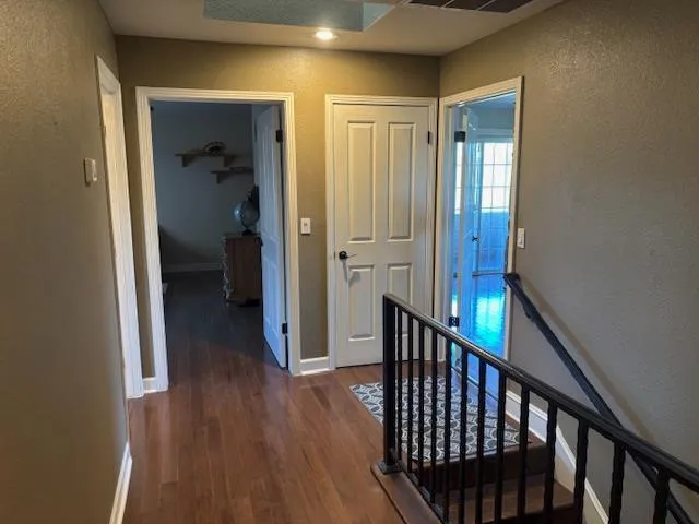 a view of balcony with wooden floor