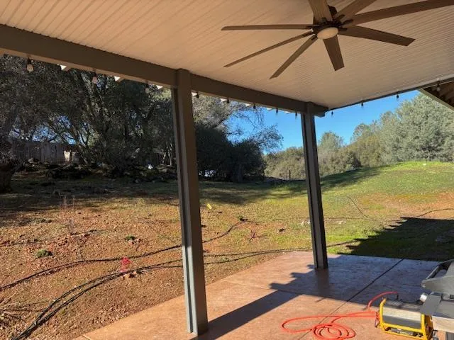 a front view of a house with a yard outdoor seating and garage