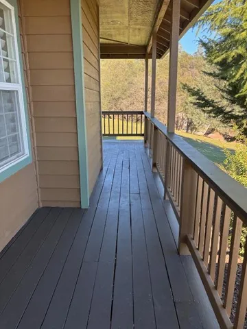 a view of balcony with wooden floor